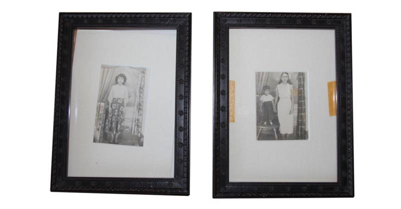 Two framed prints by an unknown Puerto Rican photographer of two anonymous townspeople in Lares, among the few things Norma Quintana saved from the fire.