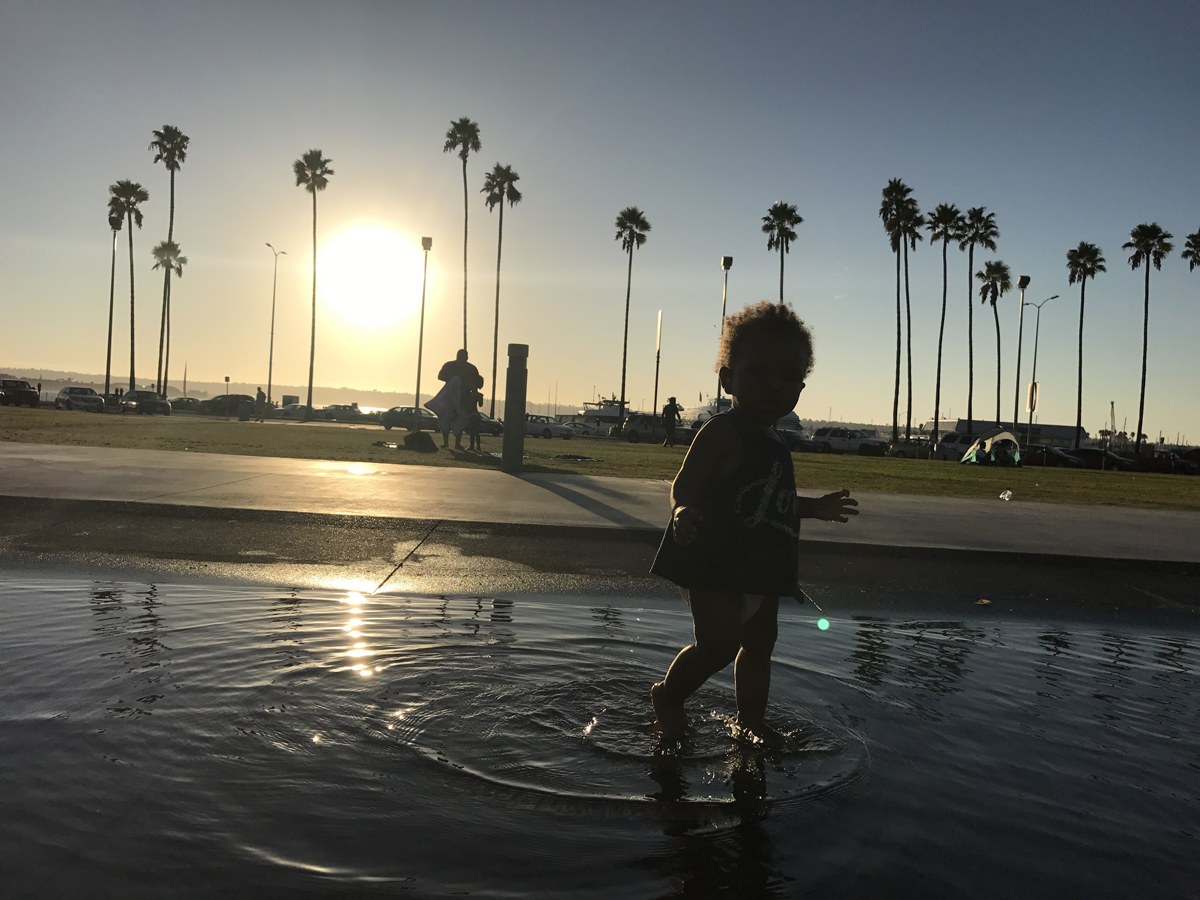 Independent playtime: The author's daughter playing in water.