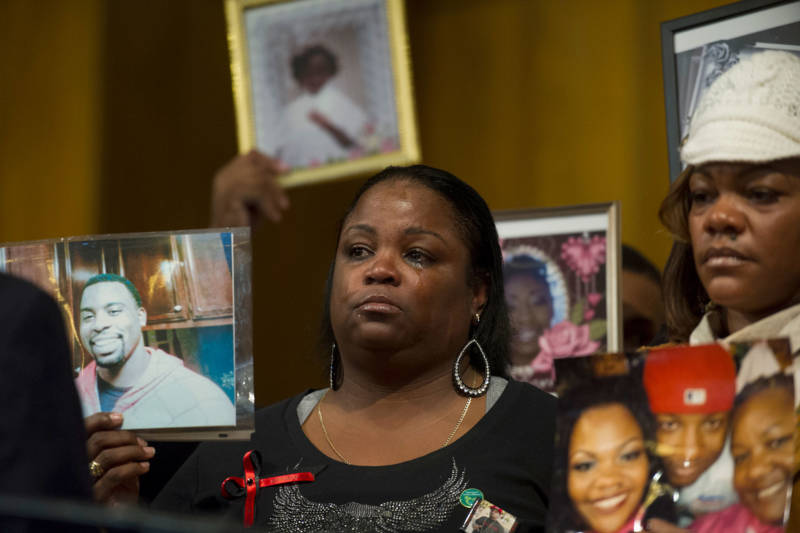 Antionette Johnson holds a photo of her son Terrell Reams, 23, who was shot and killed in Oakland in 2013.