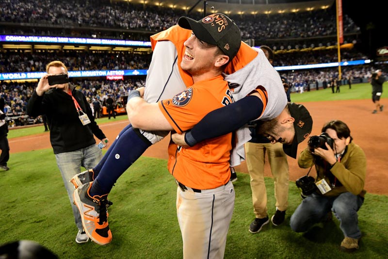 Alex Bregman #2 and Jose Altuve #27 of the Houston Astros celebrate after defeating the Los Angeles Dodgers 5-1 in game seven to win the 2017 World Series at Dodger Stadium on November 1, 2017 in Los Angeles, California. 