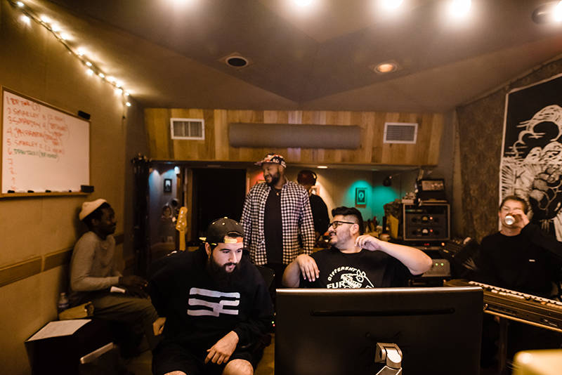 Text Me Records engineer Jorge Hernandez (center) in a session with artists Channel Tres and 1-O.A.K. at New Monkey Studios in Van Nuys.