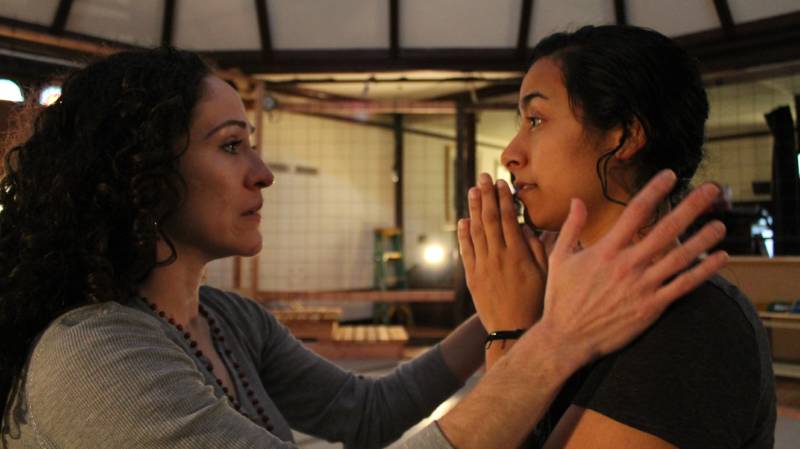 (L to R) Juana (Sarita Ocón) confronts the angelic Carmen (Carla Gallardo) in the Ubuntu Theater Project's production of 'To the Bone' by Lisa Ramirez.