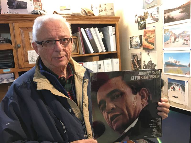 Gene Beley, formerly a reporter with the Ventura Star Free Press, poses with his copy of Cash's seminal 1968 album. Beley traveled alongside Cash for the gig and recorded the rehearsal the night before and the concert.