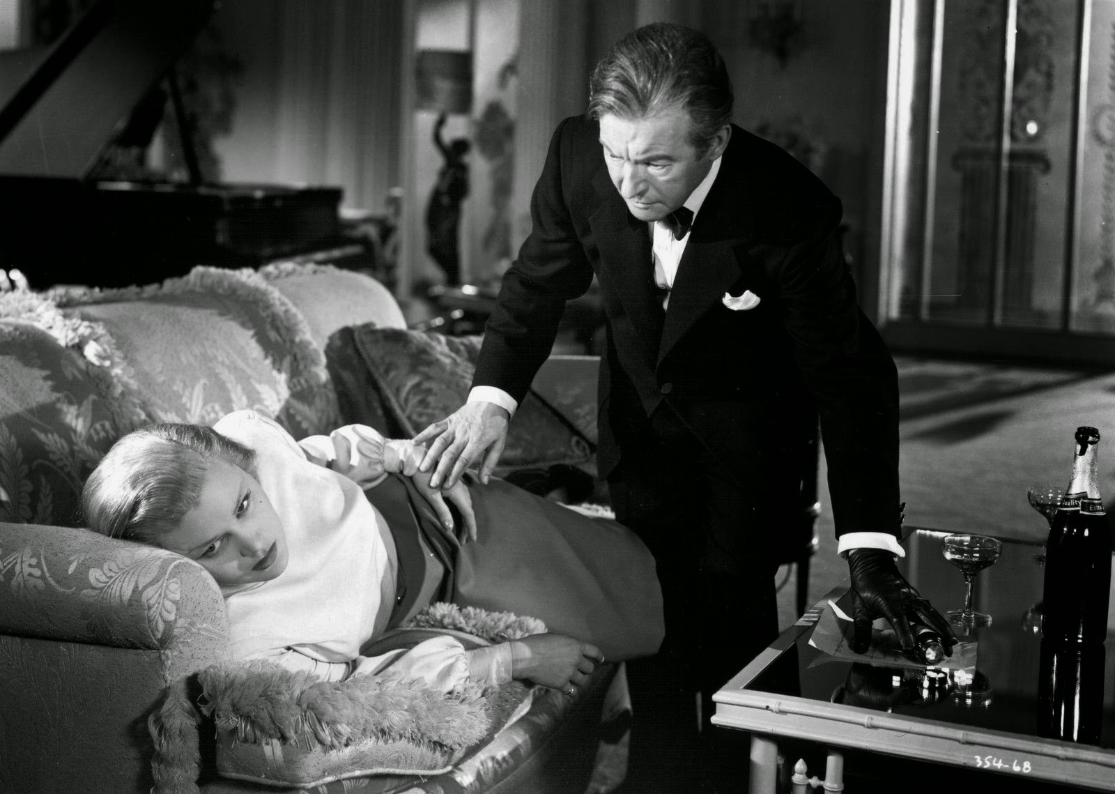 Scene from 'The Unsuspected' with Joan Caulfield and Claude Rains, 1947.