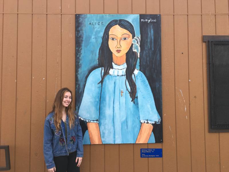 Pinole Valley High School grad Shaye Maxey poses with her mural, a reproduction of Modigliani's 'Alice'.