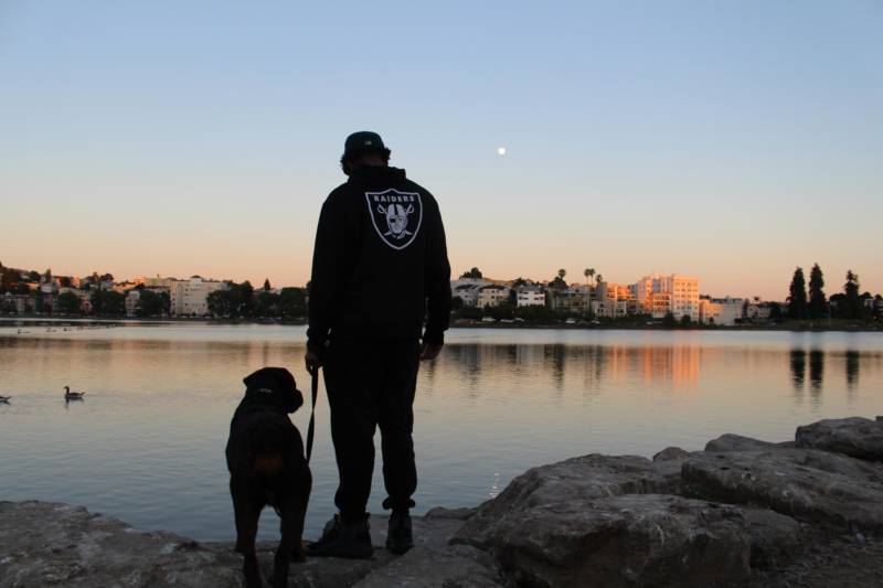 Rocky takes his human, Keith Gregory, on an evening walk around Lake Merritt.