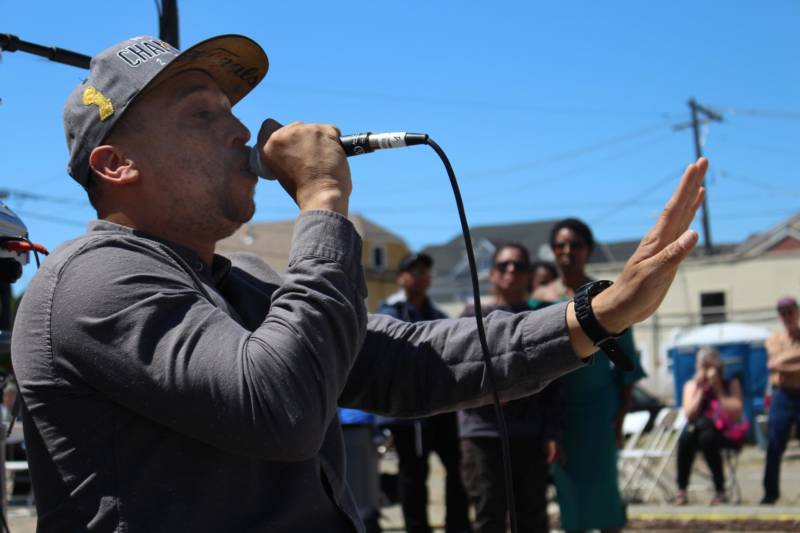 Kev Choice, ever animated, performs at an event in West Oakland.