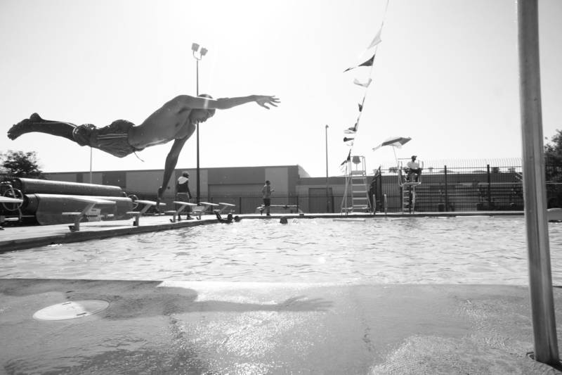 West Oakland’s own Beejus takes a dive in the DeFremery (Lil' Bobby Hutton) Park pool.