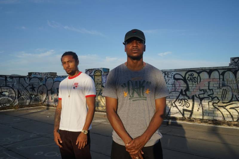 The Afro-Panamanian rap duo Los Rakas on top of the old train station in West Oakland.