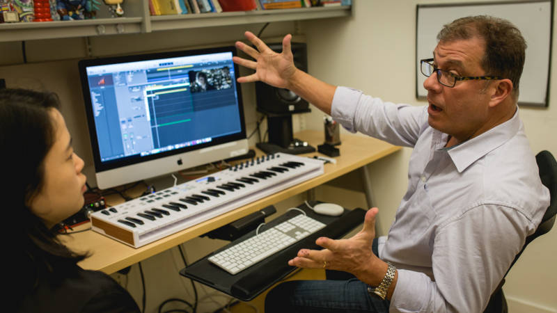 SFCM professor Clint Bajakian, a veteran composer who has done audio for game franchises like 'God of War' and 'Star Wars,' in a private lesson with a student.