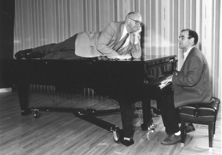Kasell decides to take a publicity photo shoot up a notch while 'Wait Wait... Don't Tell Me!' host Peter Sagal tickles the ivories.