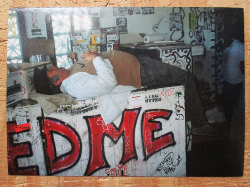 Steve Koepke lounging on a counter at the Gilman.