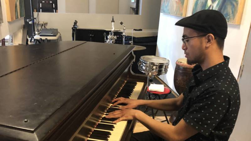 Theo Alvarez plays the piano at the I-Hotel Manilatown Center in North Beach.