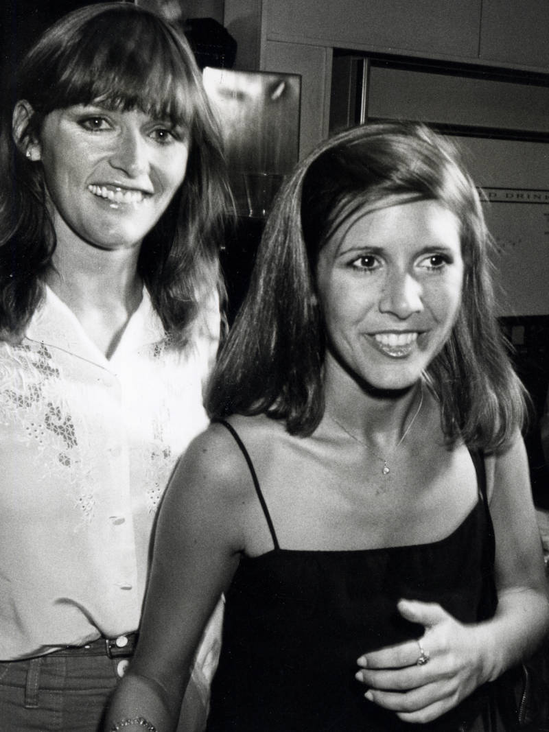 Margot Kidder is seen here with Carrie Fisher, as the two attended a fundraiser in 1980, at the Empire State Building in New York City. Fisher died in December of 2016.