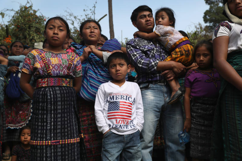 Families attend a memorial service for two boys who were kidnapped and killed on Feb. 14, 2017, in San Juan Sacatepequez, Guatemala. Such crimes have driven emigration from Guatemala to the United States, as families seek refuge from the violence.