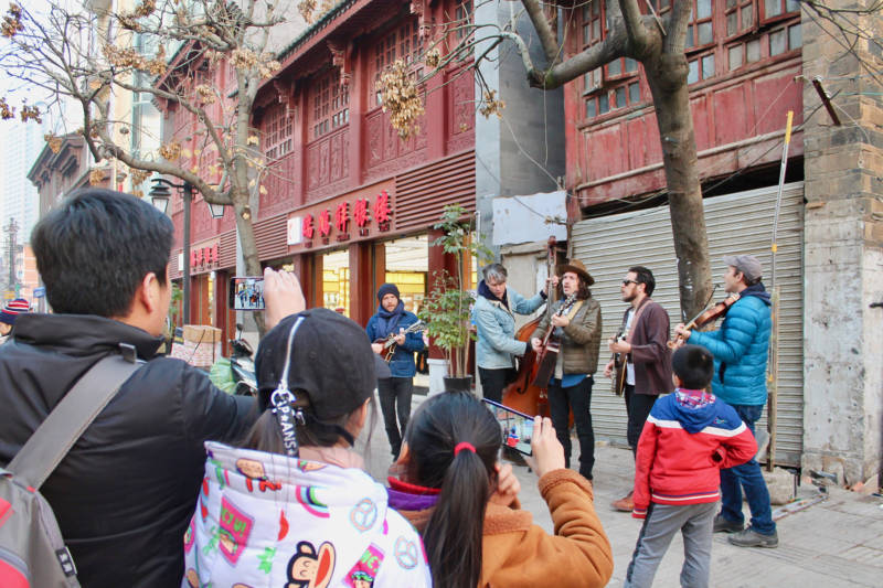 The Brothers Comatose perform on the street in Kunming, China. 
