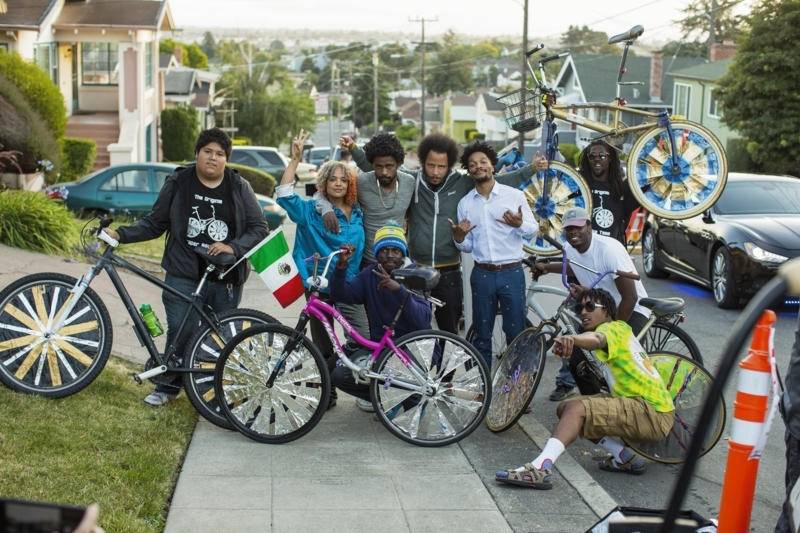 Tessa Thompson, Lakeith Stanfield, Boots Riley and Jermaine Fowler from the cast of 'Sorry to Bother You' with members of the Scraper Bike team in Oakland.