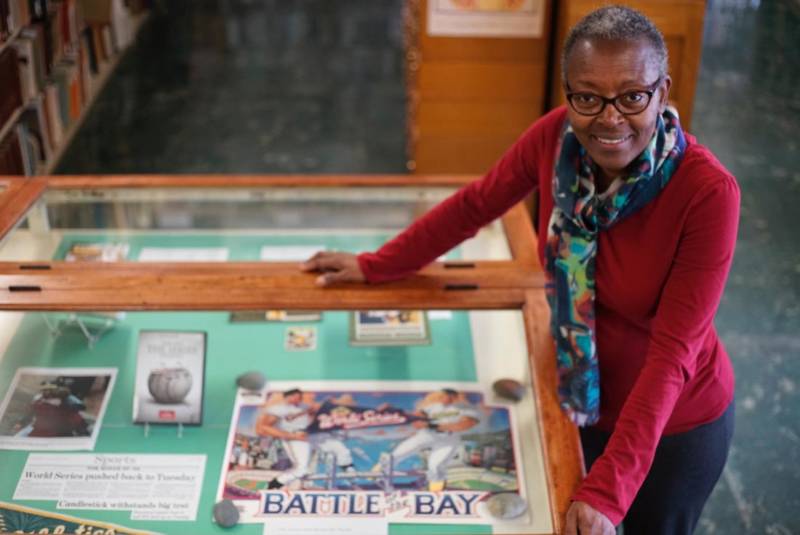 The Oakland Library's Dorothy Lazard with an exhibition commemorating the A's 50 years in Oakland.