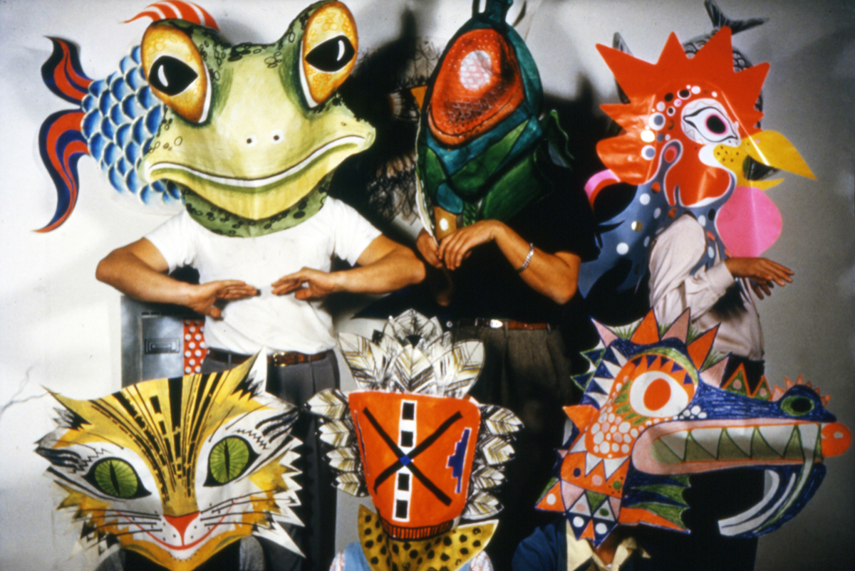 Eames Office staff wearing prototype toy masks, 1950.