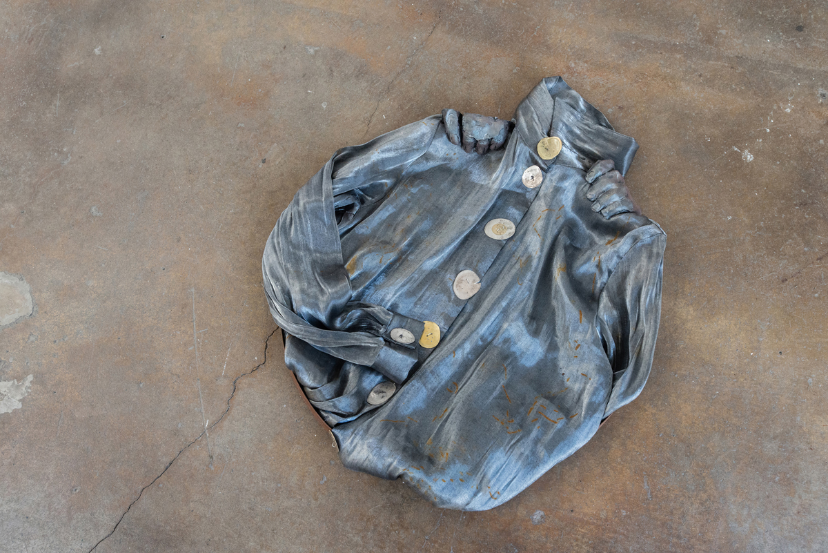Jenine Marsh, 'contortion (steel),' 2018; Found metal ring, rust-stained blouse, train-flattened and drilled coins of mixed currencies, wire, gypsum cement, powdered pigment.