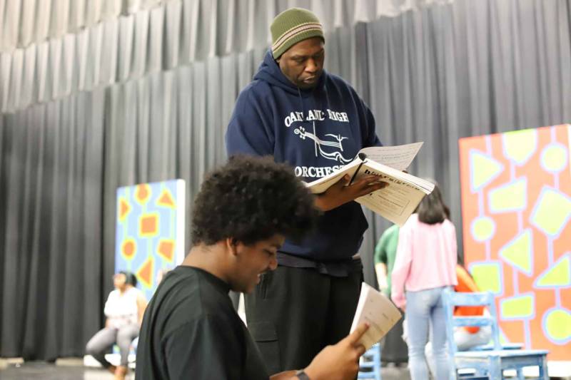 David Byrd consults with the pit band in rehearsals for 'Hairspray' at Oakland High School.