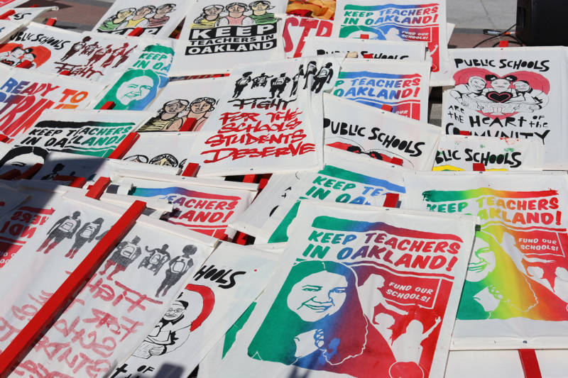 Local artists contributed imagery for Oakland teachers strike banners. 