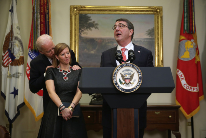 Joe Biden whispers in Christine Carter's ear in 2015.