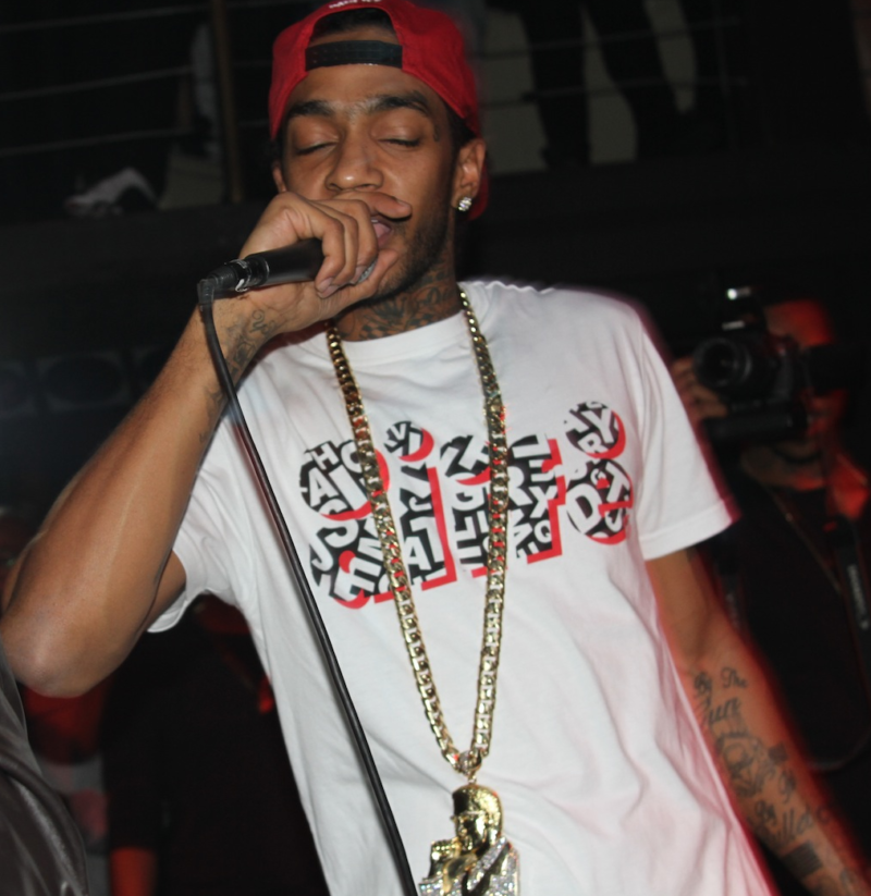 Nipsey and his Malcolm X medallion