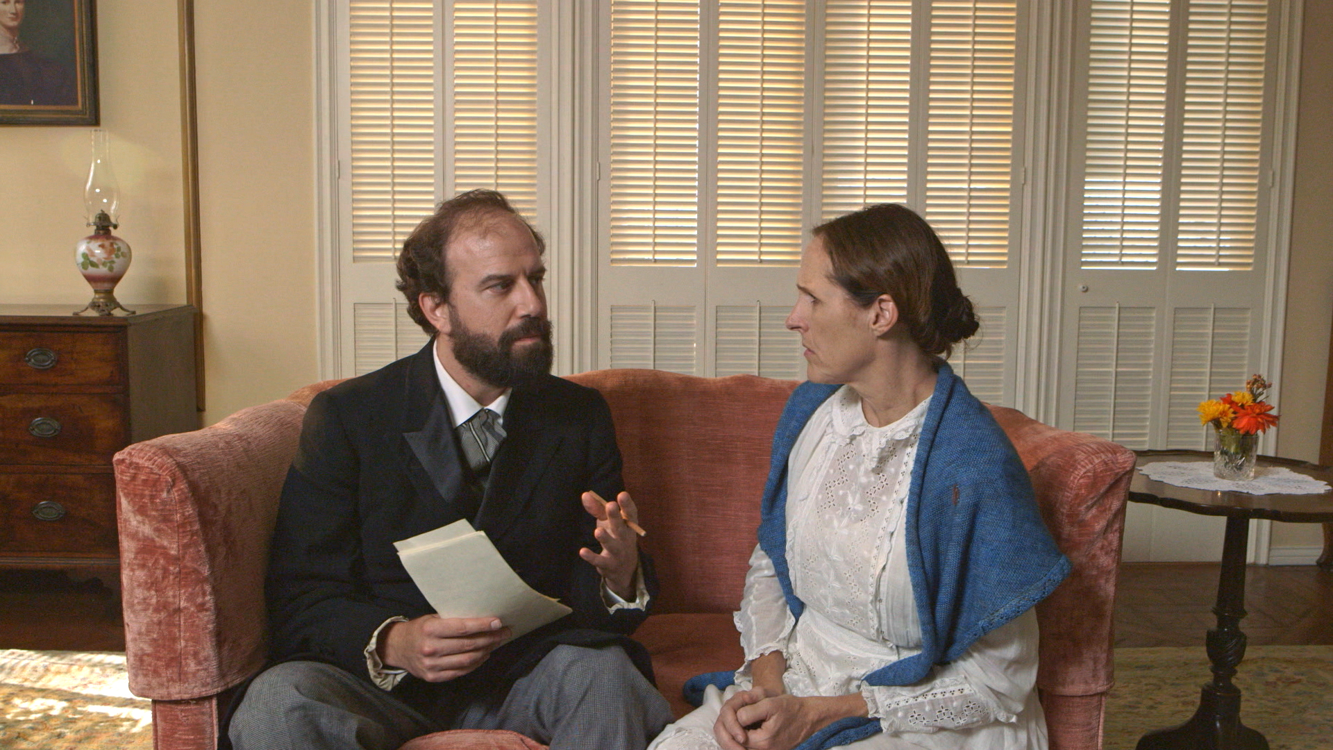 Higginson (Brett Gelman) takes a knife to Emily's poems in 'Wild Nights with Emily.'