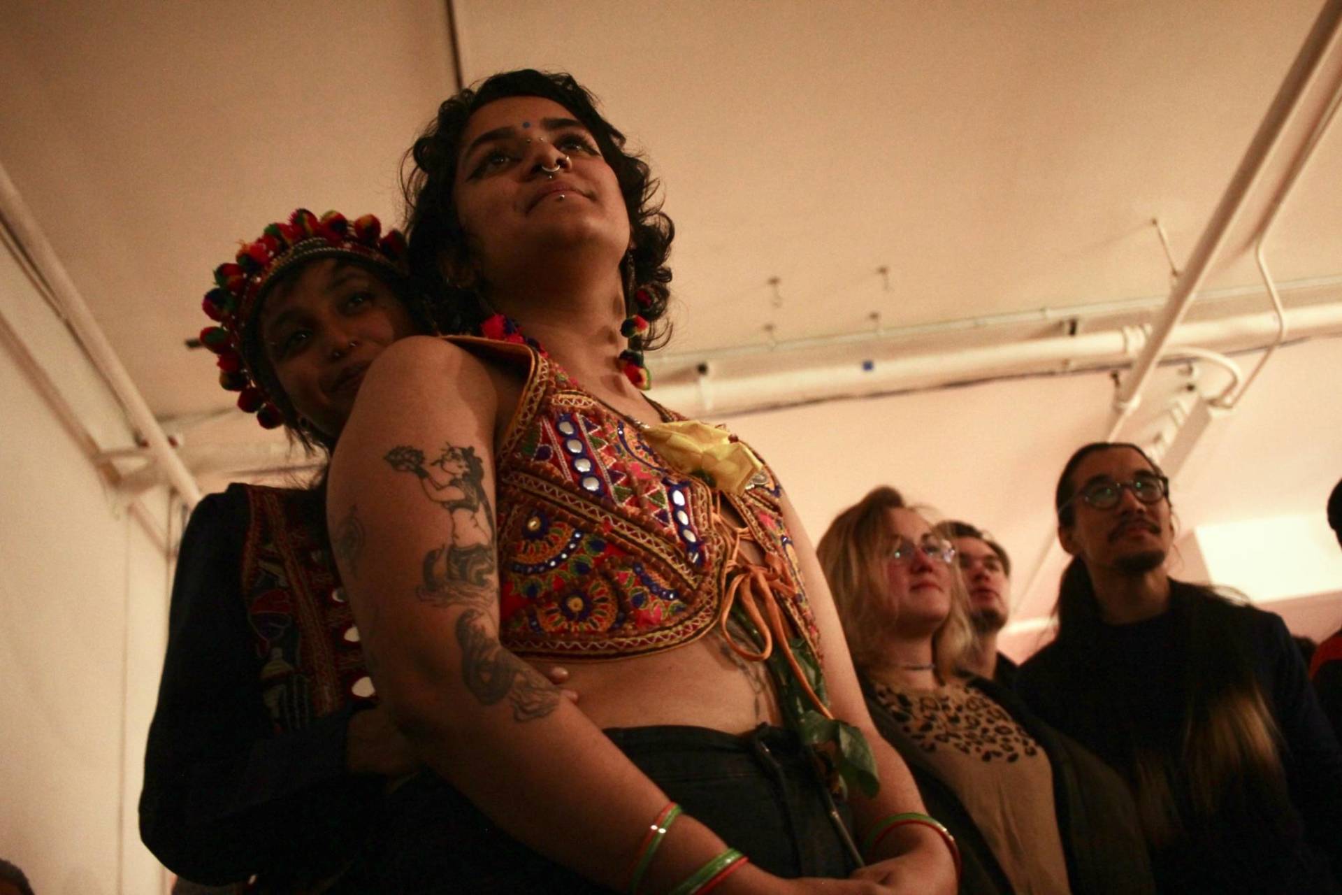 Shannon Prasad and madhvi trivedi-pathak embrace as they watch a performance on May 17, 2019.
