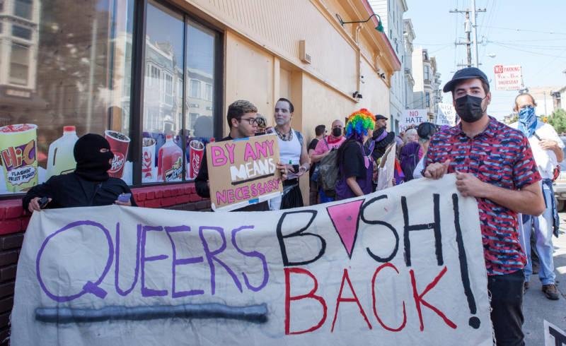 Queer Nation's confrontational tactics and slogans like "Queers bash back" continue to influence LGBTQ activists. Here, protesters carry a "Queers bash back" sign at a Patriot Prayer counter-demonstration in San Francisco in 2017.