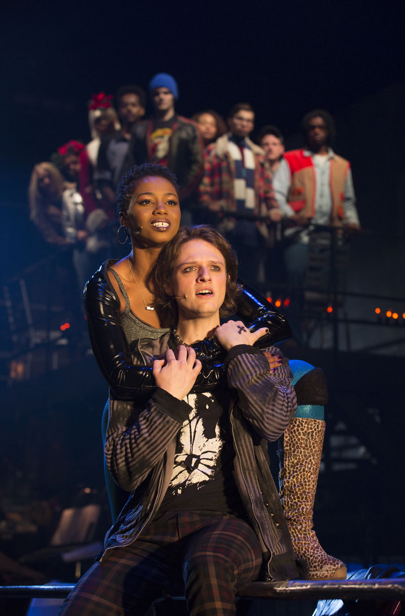 (L-R) Deri'Andra Tucker as Mimi and Joshua Bess as Roger with the company of the RENT 20th Anniversary Tour.
