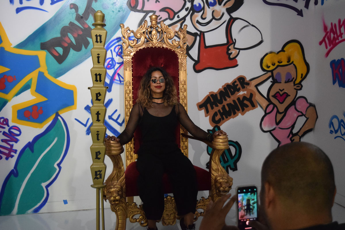 Artist Maria Garcia poses on a 'Fresh Prince' throne.