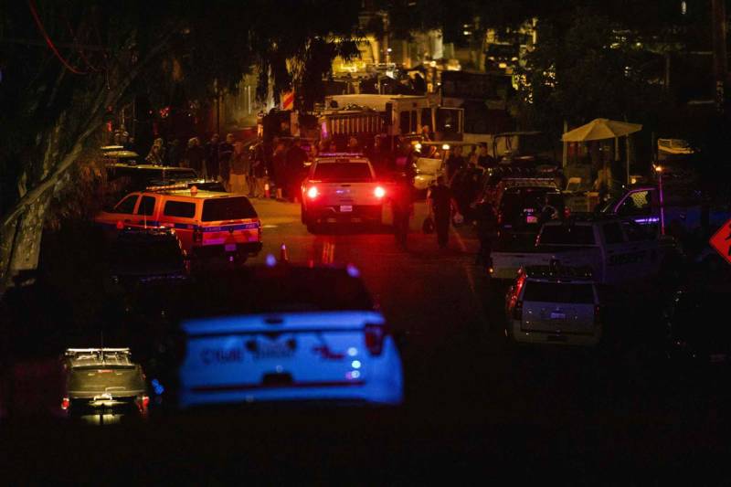Police officers arrive on the scene of the investigation following a deadly shooting at the Gilroy Garlic Festival in Gilroy, California on July 28, 2019. 
