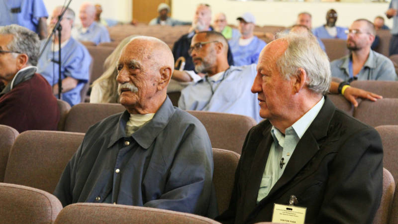 Curly Ray Martin (L), who once shared a cell with Merle Haggard, sits next to Country Music writer and co-producer Dayton Duncan (R).