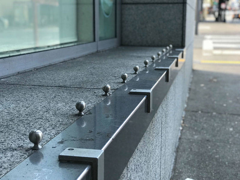 A cafe on Larkin in the Tenderloin uses metal attachments to prevent people from sitting in an open windowsill. "Being aware of hostile design helps people know what their city is interested in doing," says Kurt Kohlstedt.
