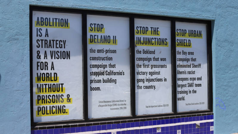 Critical Resistance marks successful and ongoing campaigns against the prison-industrial complex in the windows of its new building. 