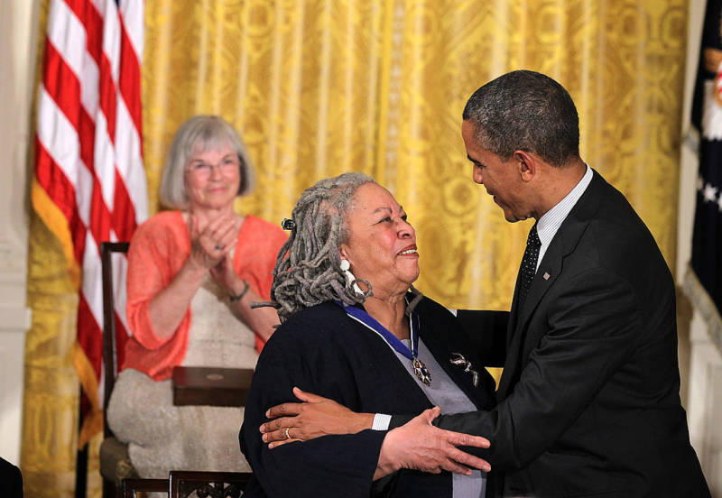 Novelist Toni Morrison and U.S. President Barack Obama share a moment after she was presented with a Presidential Medal of Freedom. 