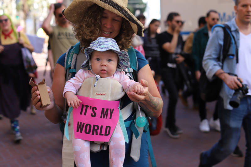 Demonstrators at the Climate Strike in San Francisco on Sept. 20, 2019. A mother holds a baby with the sign "It's my world."