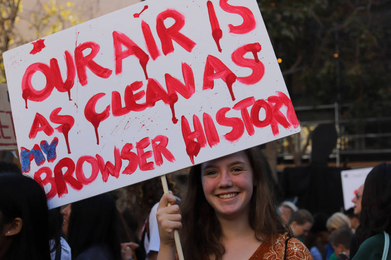 Demonstrators at the Climate Strike in San Francisco on Sept. 20, 2019. A teenage girl holds a sign that says "Our air is as clean as my browser history."