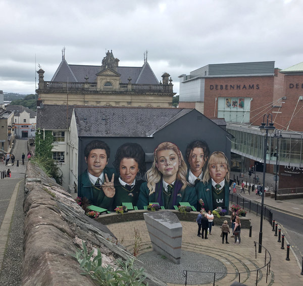 A mural of the Derry Girls is painted on the side of the bar and restaurant Badgers.
