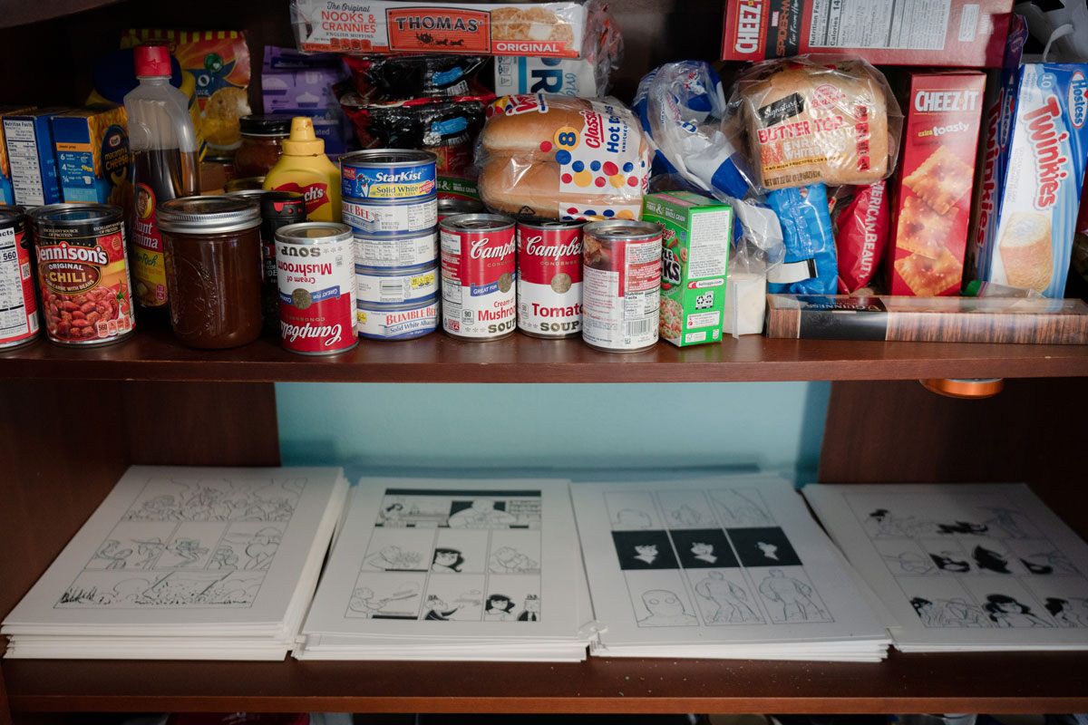 Beland's pantry holds food and stacks of drawings.