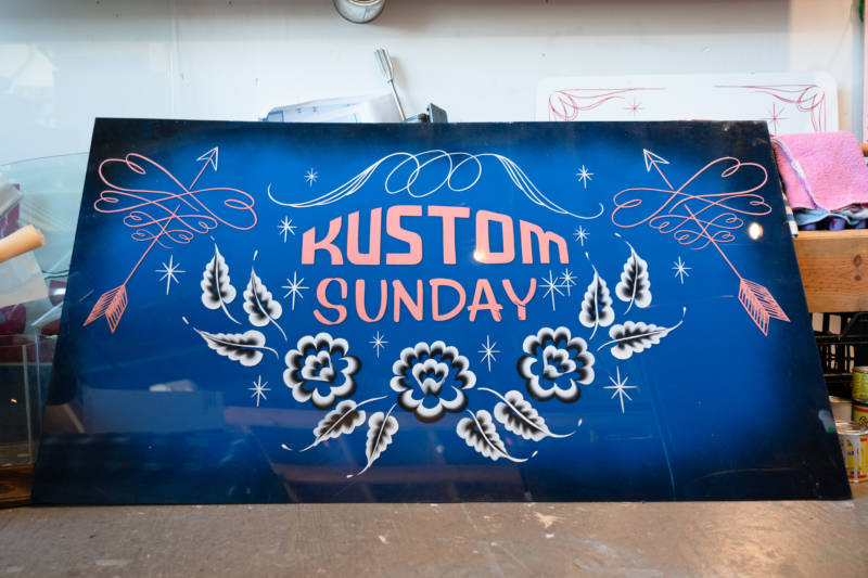 In addition to sign painting and their own art, Isaac Avila and Lauren D'Amato host Kustom Sunday, a car culture meetup in San Francisco.