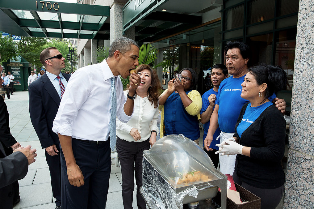 President Barack Obama samples food outside Naan & Beyond, an Indian restaurant in Washington, D.C., June 9, 2014.