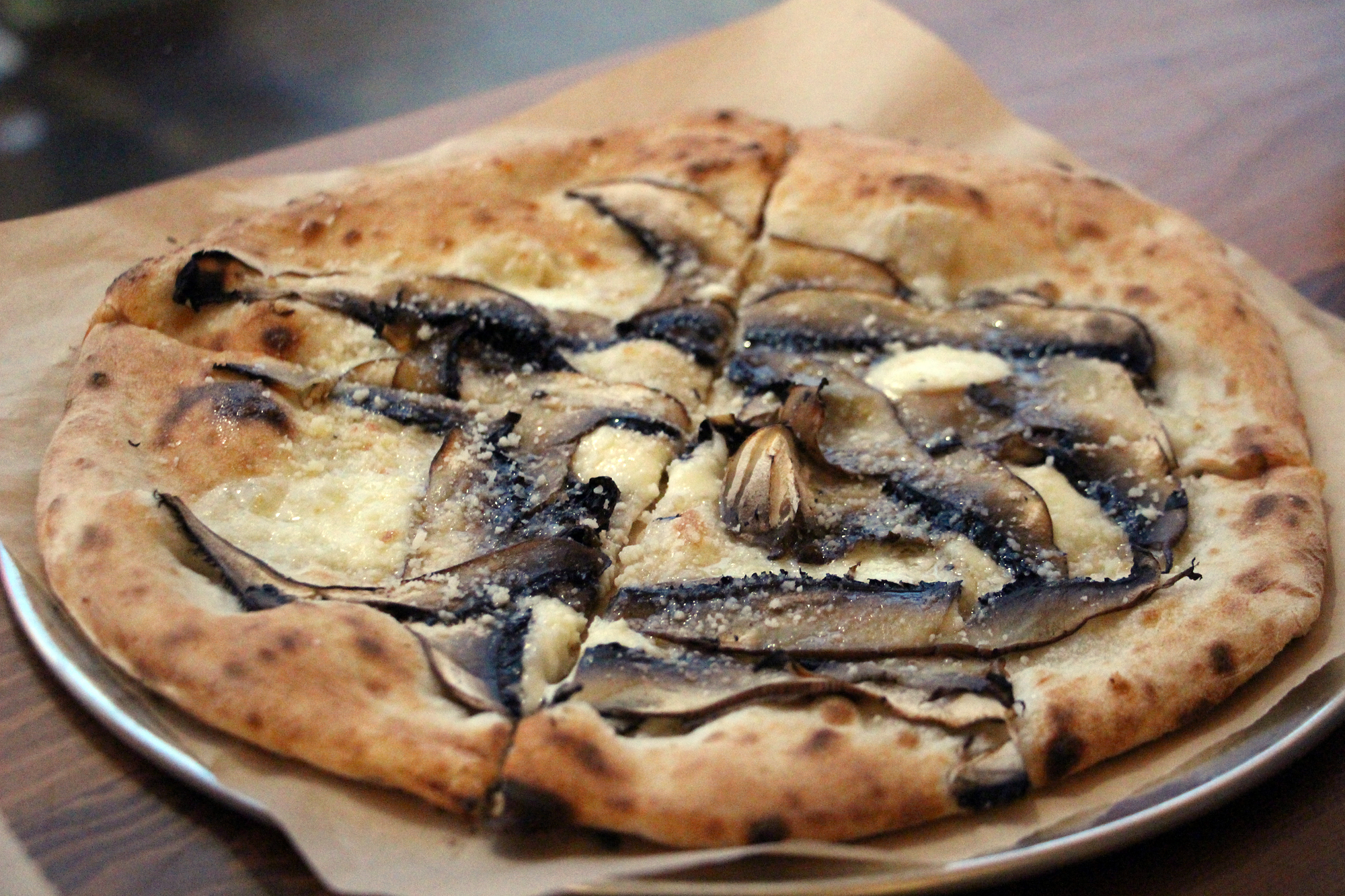 TKO pizza with Portobello mushrooms and truffle oil.