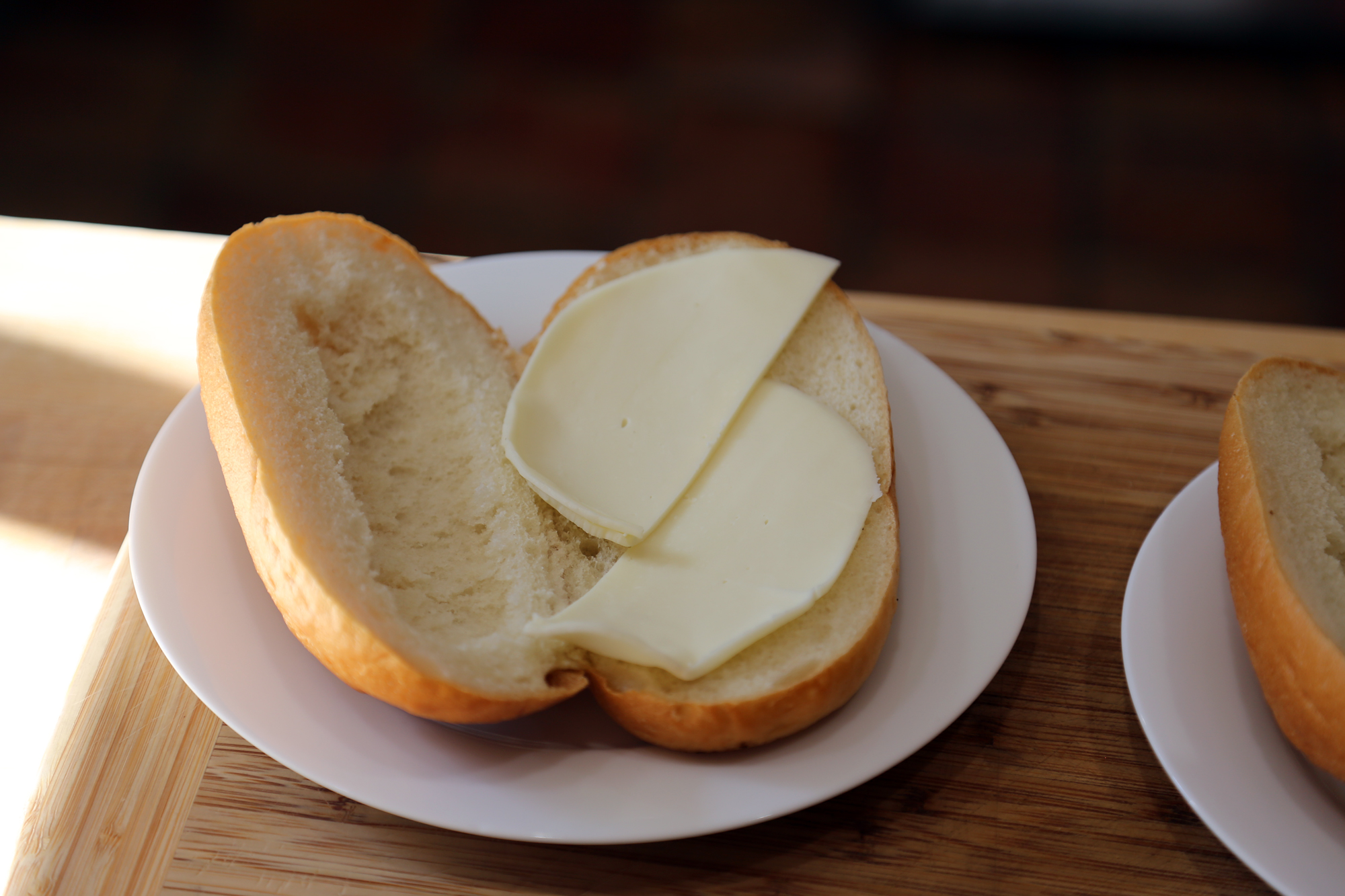 Line the bottom of each roll with 1 oz Provolone, cutting to fit.