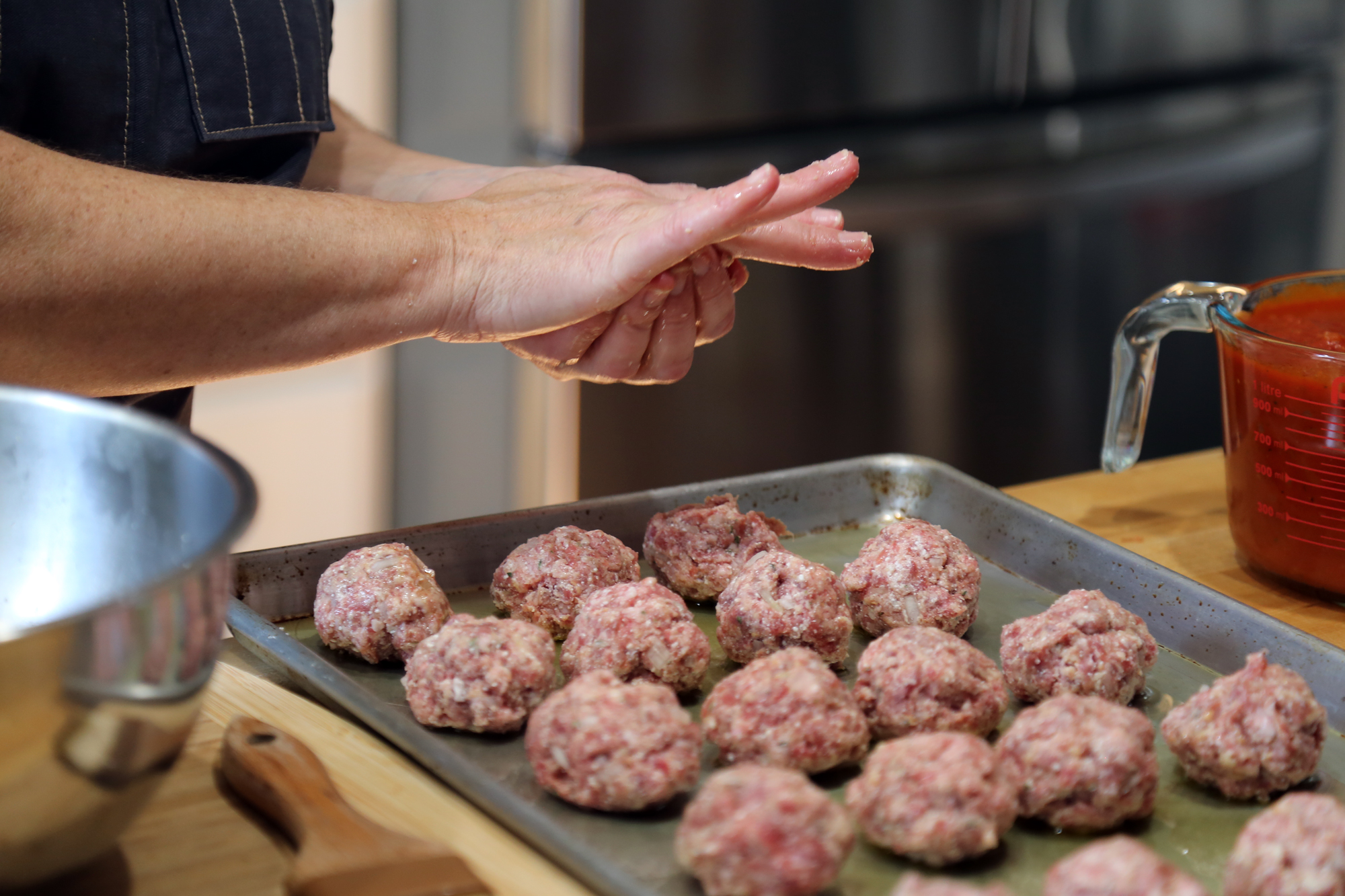 Shape into meatballs, each about 1-inch in diameter; you should end up with about 20 meatballs. Transfer the meatballs to the baking sheet.