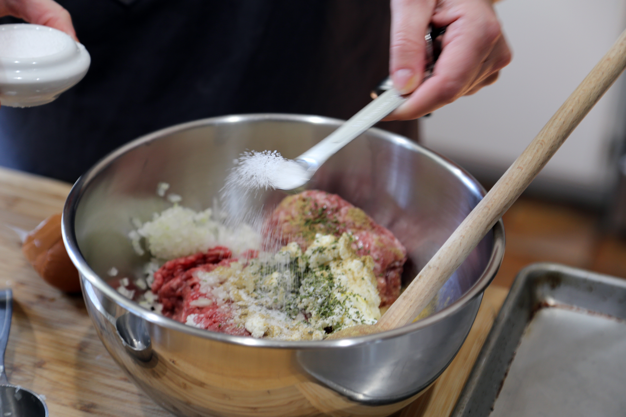 In a large bowl, add the beef, pork, eggs, ricotta, bread crumbs, salt, fennel, and oregano.