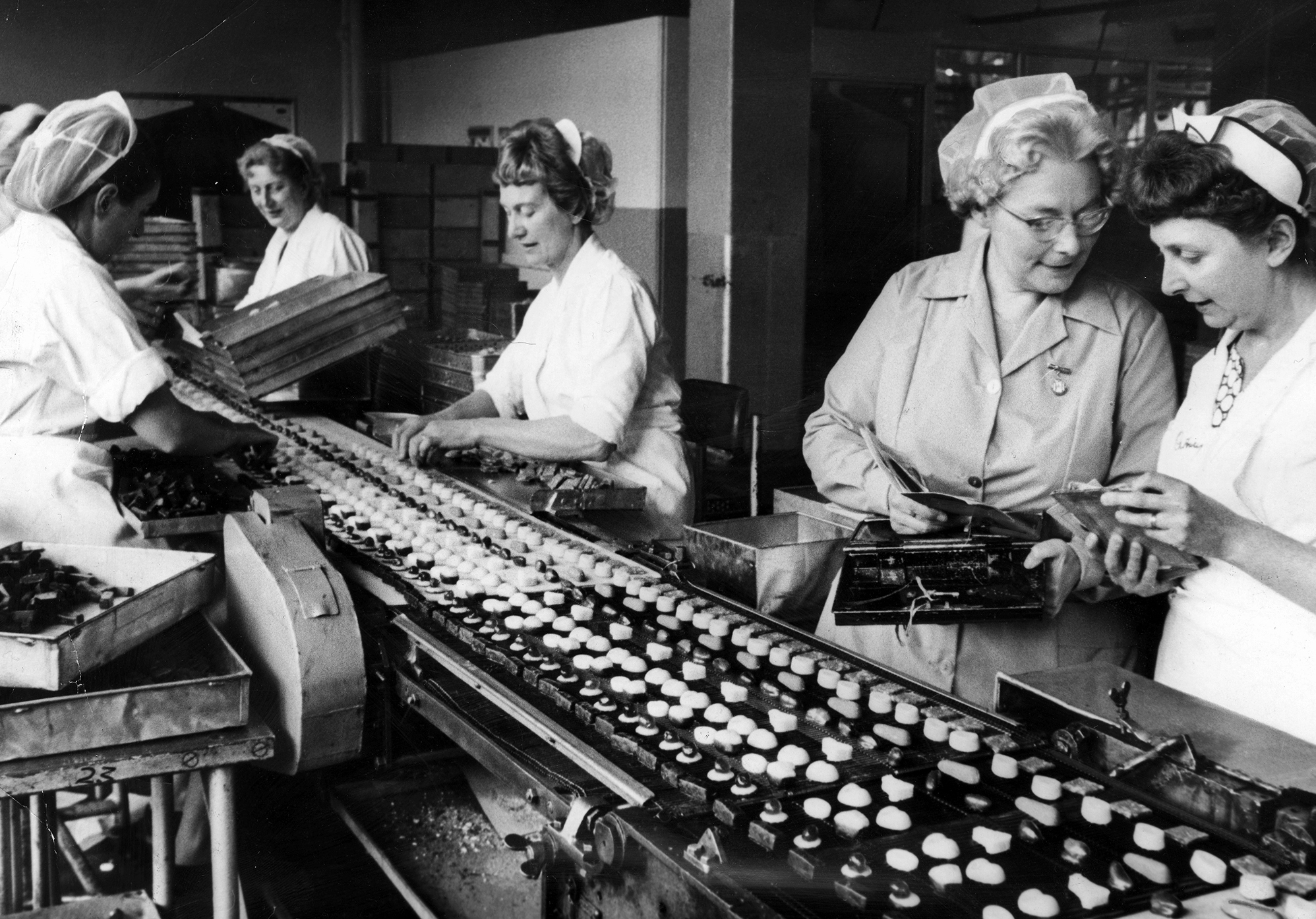 It was Cadbury that first linked Valentine's Day with those heart-shaped boxes filled with chocolates nestled in lace doilies. Here, women work on a production line at Cadbury's in England in 1966.
