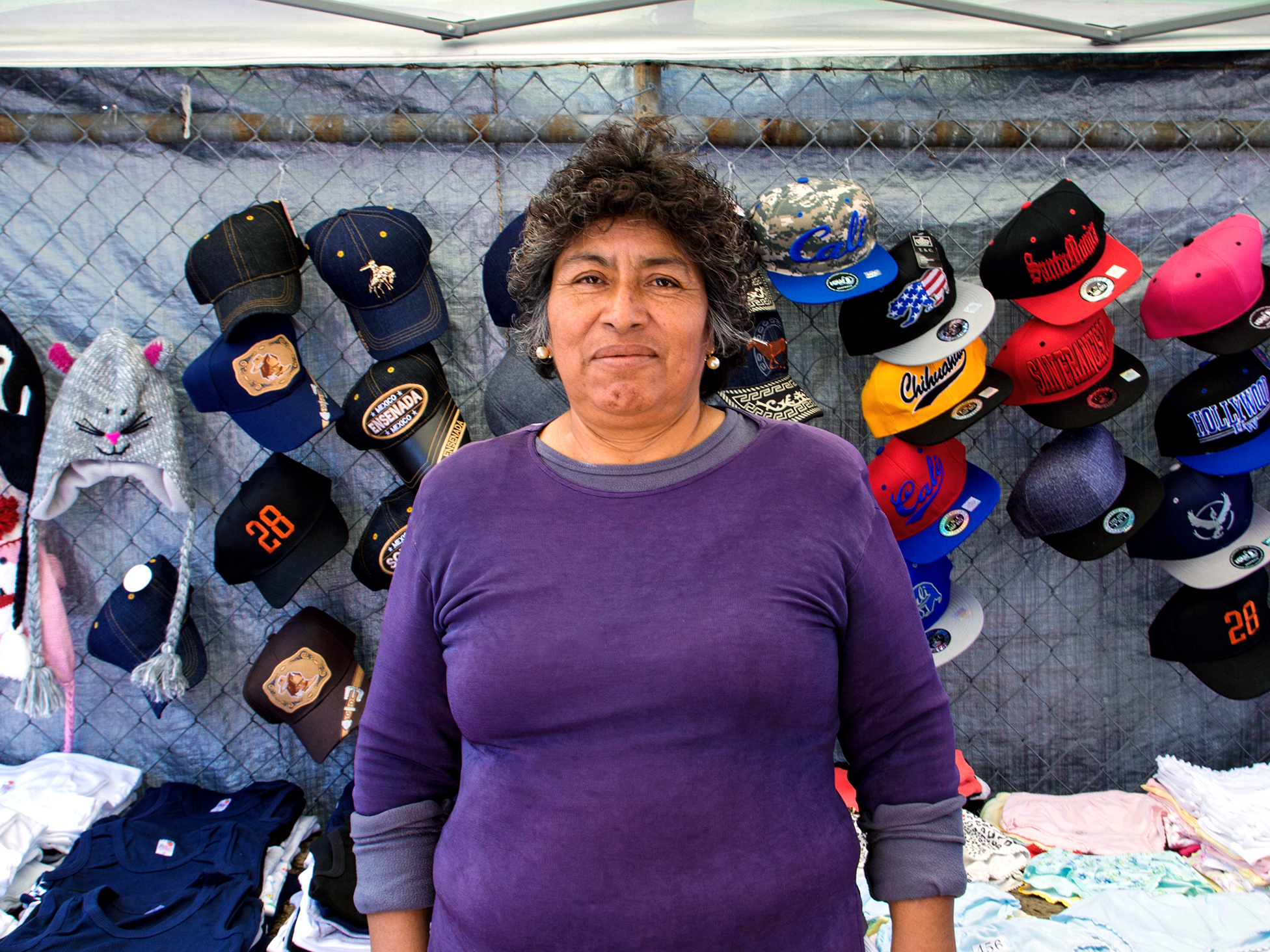 Merced is a vendor in the piñata district. She is worried that the city council's plan for a legal permitting system for sidewalk vendors, as proposed, will severely limit how many vendors can be on a given sidewalk, leaving many without a place to do business.